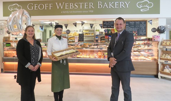 cllrs stand outside Geoff Webster Bakery in Idlewells Indoor Market 