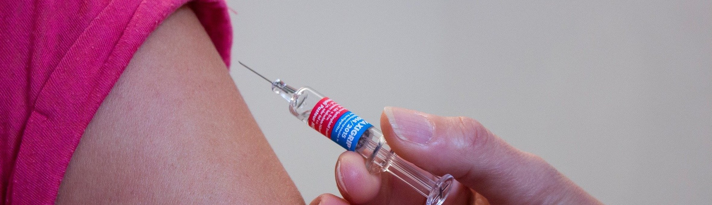 Person receiving a vaccination in their arm