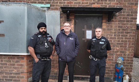 Anti-social behaviour officer and Police at the closed and boarded up address 