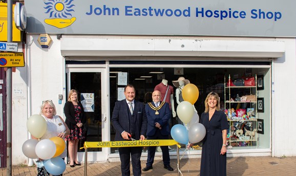 Jill Johnson standing outside John Eastwood Hospice shop with Cllrs Zadrozny and Meakin, in Sutton 