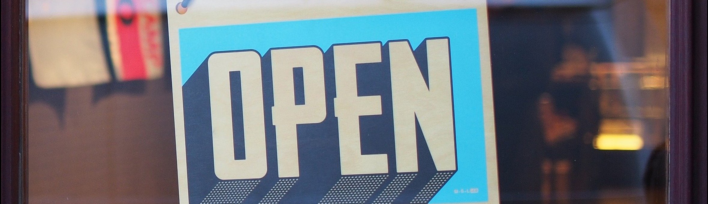 Open sign in a shop window.
