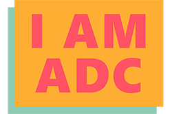 Colourful logo reading I AM ADC