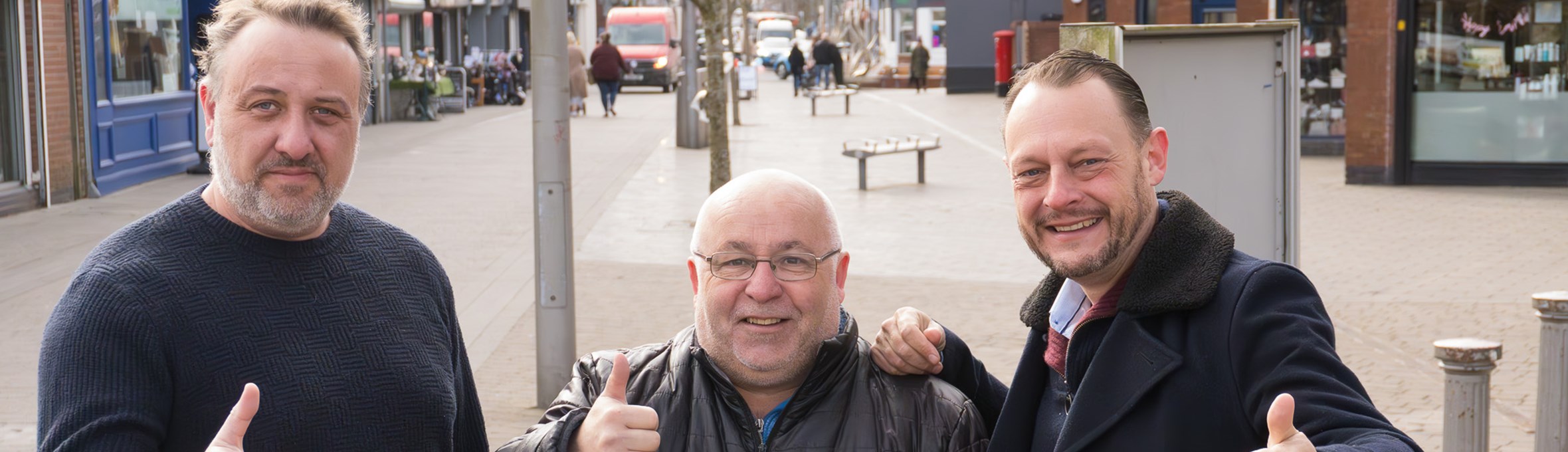 Three councillors with thumbs up in Kirkby.