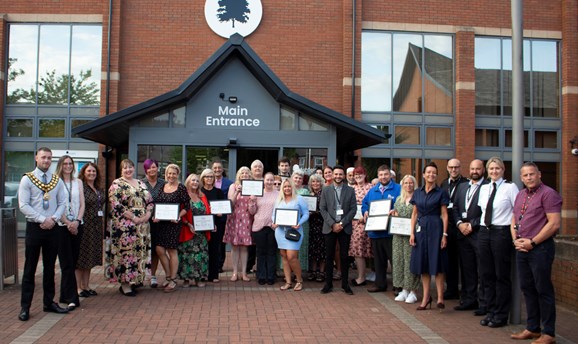 commended businesses and Council officers outside the Council building