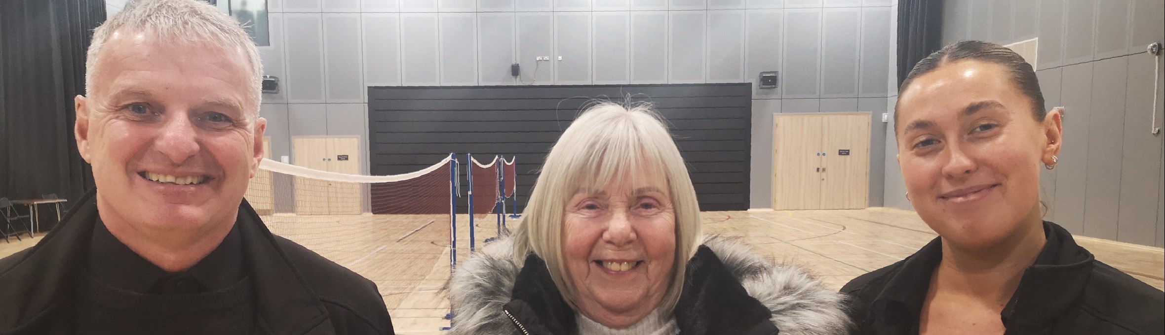 Jean Patterson, the 100,000th visitor at Kirkby Leisure Centre, receiving her £100 voucher.