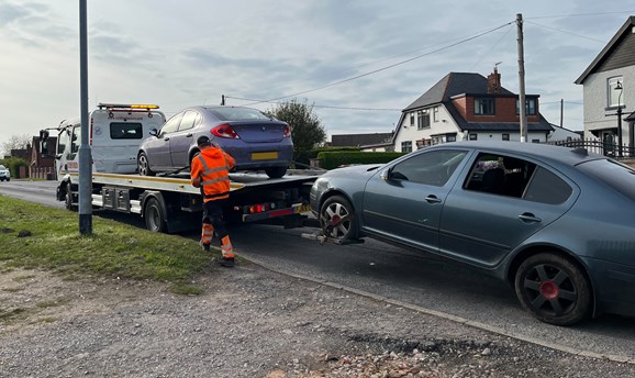 Vehicles being seized on Diamond Avenue in Kirkby 