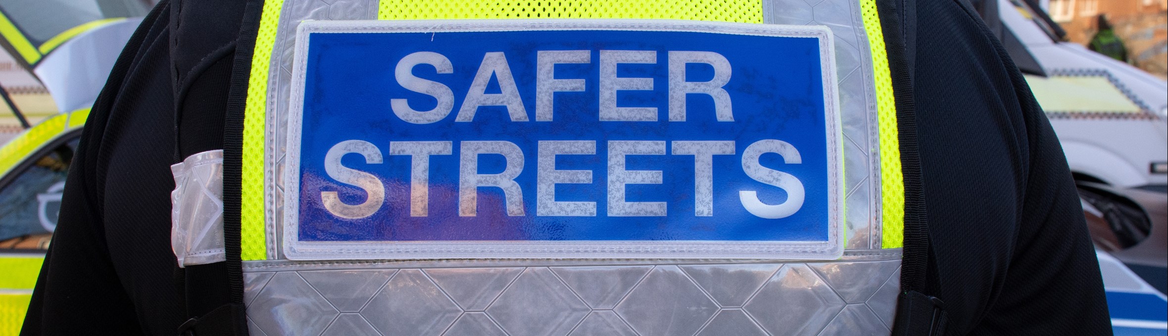 Protection Officer wearing a Safer Streets high-vis jacket 