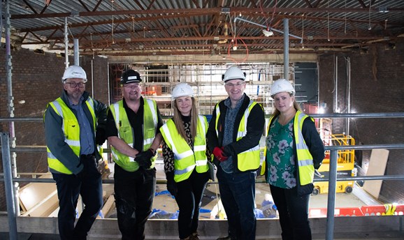 Cllr Matthew Relf with two men and two women all smiling in high-vis vests