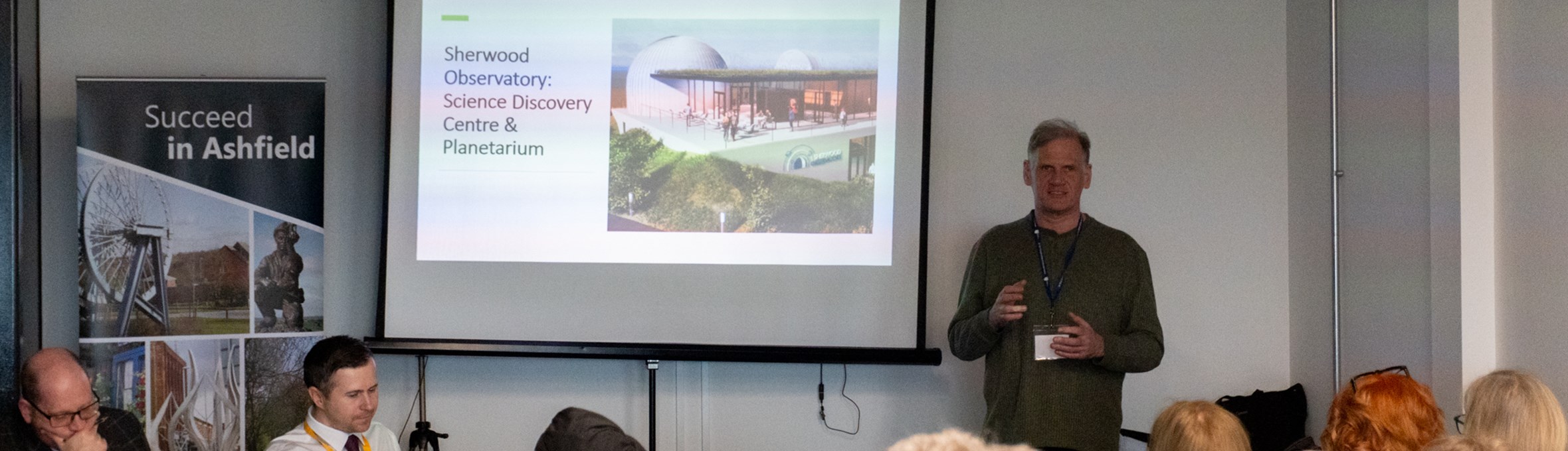 A group listening to a Sherwood Observatory talk at the Succeed in Ashfield event