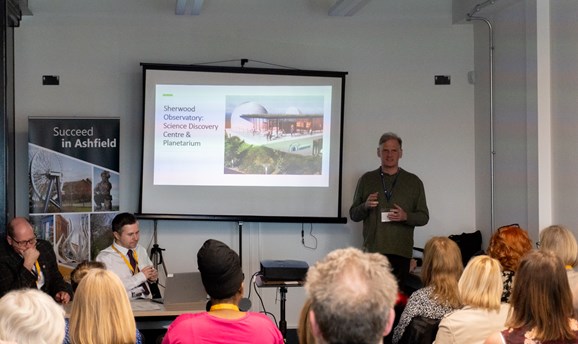 A group listening to a Sherwood Observatory talk at the Succeed in Ashfield event