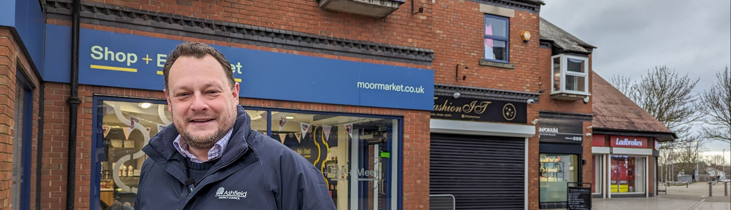 Cllr Jason Zadrozny outside moor market in kirkby