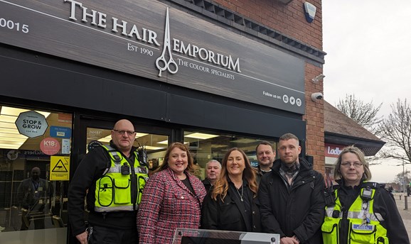 group picture of people outside the Hair Emporium salon promoting the Safe Space scheme