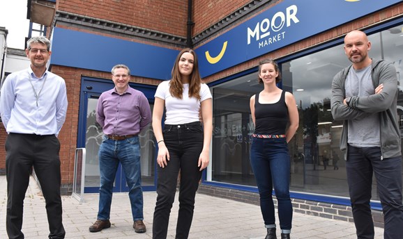 Council officers and competition winner stood outside Moor Market 