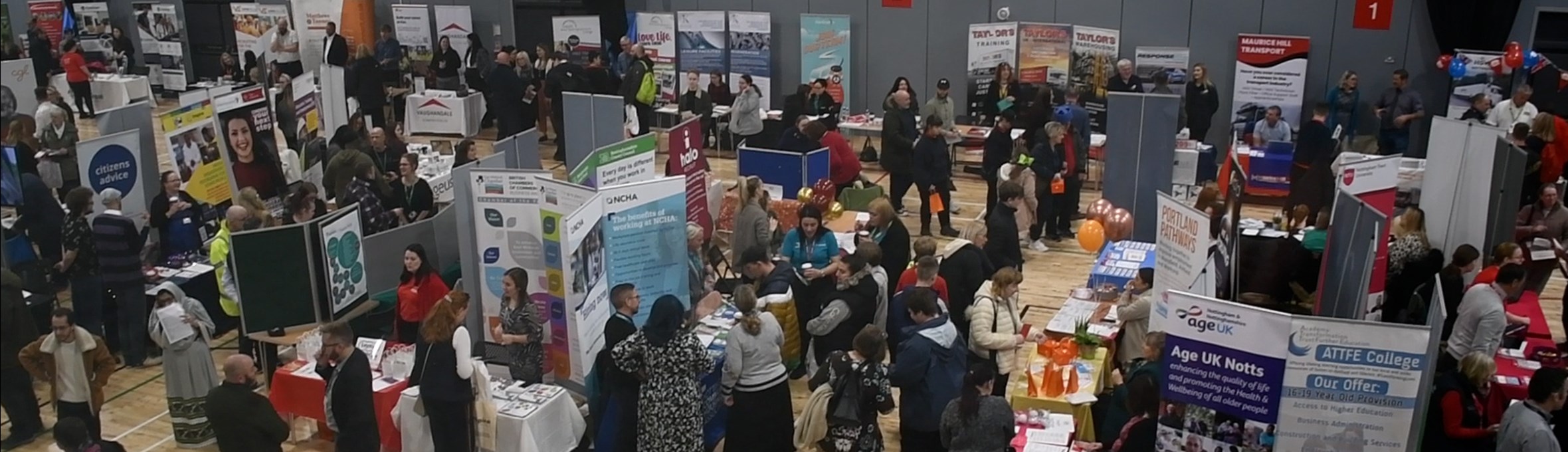 Photo of the careers fair in the sport hall at Kirkby leisure centre 