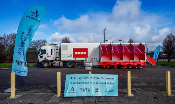 a giant lorry featuring a sign saying Mobile Museum 