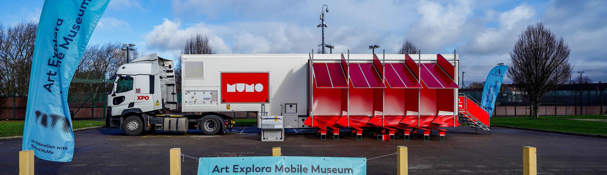 a giant lorry featuring a sign saying Mobile Museum