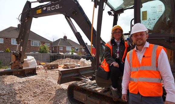 Diane Sheldon with Cllr Tom Hollis at the housing development named after son