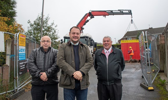 Three councillors stand in front of a building site on Darley Avenue. Kirkby 